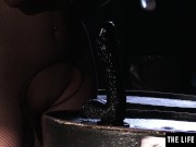 Sexy girl in fishnet body stocking rides a huge mock cock 4/16