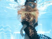 The pool becomes her stage, her movements an aquatic ballet 1/16