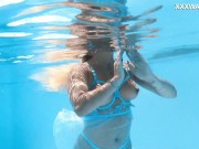 The pool becomes her stage, her movements an aquatic ballet 13/16