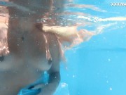 The pool becomes her stage, her movements an aquatic ballet 14/16